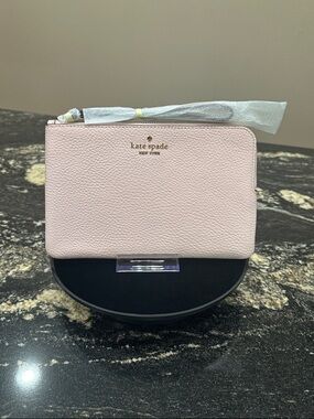kate spade soft pink zip-around wristlet